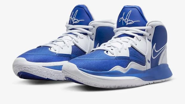 View of blue and white Nike Kyrie shoes.